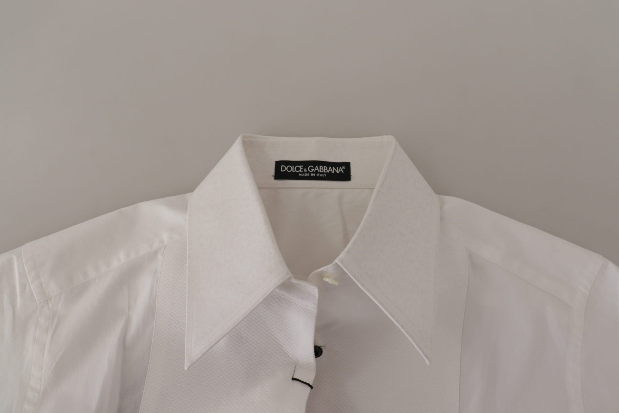 Dolce & Gabbana - Élégant chemisier de smoking sans manches avec boutons en cristal