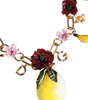 Collier Dolce & Gabbana avec pendentifs en laiton doré et logo en cristal et fleurs