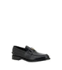 Mocassins Prada en cuir noir avec logo