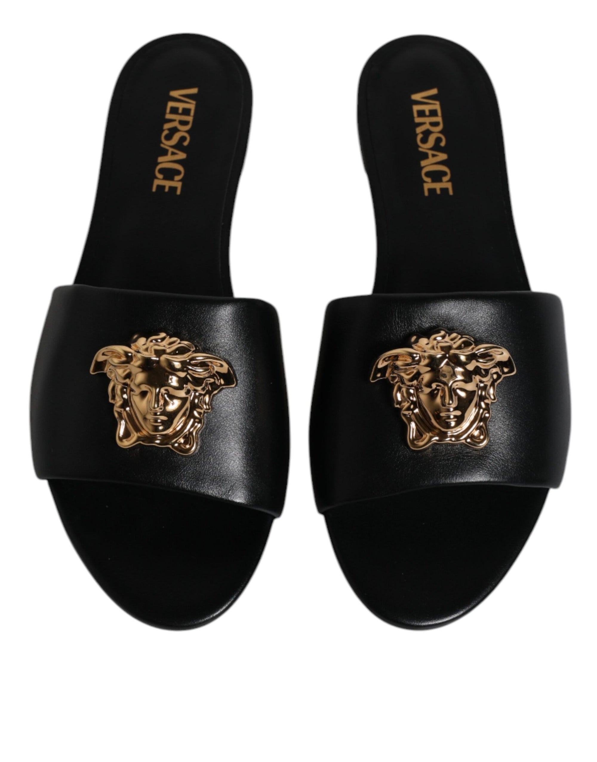 Claquettes plates à enfiler en cuir noir avec plaque logo Versace