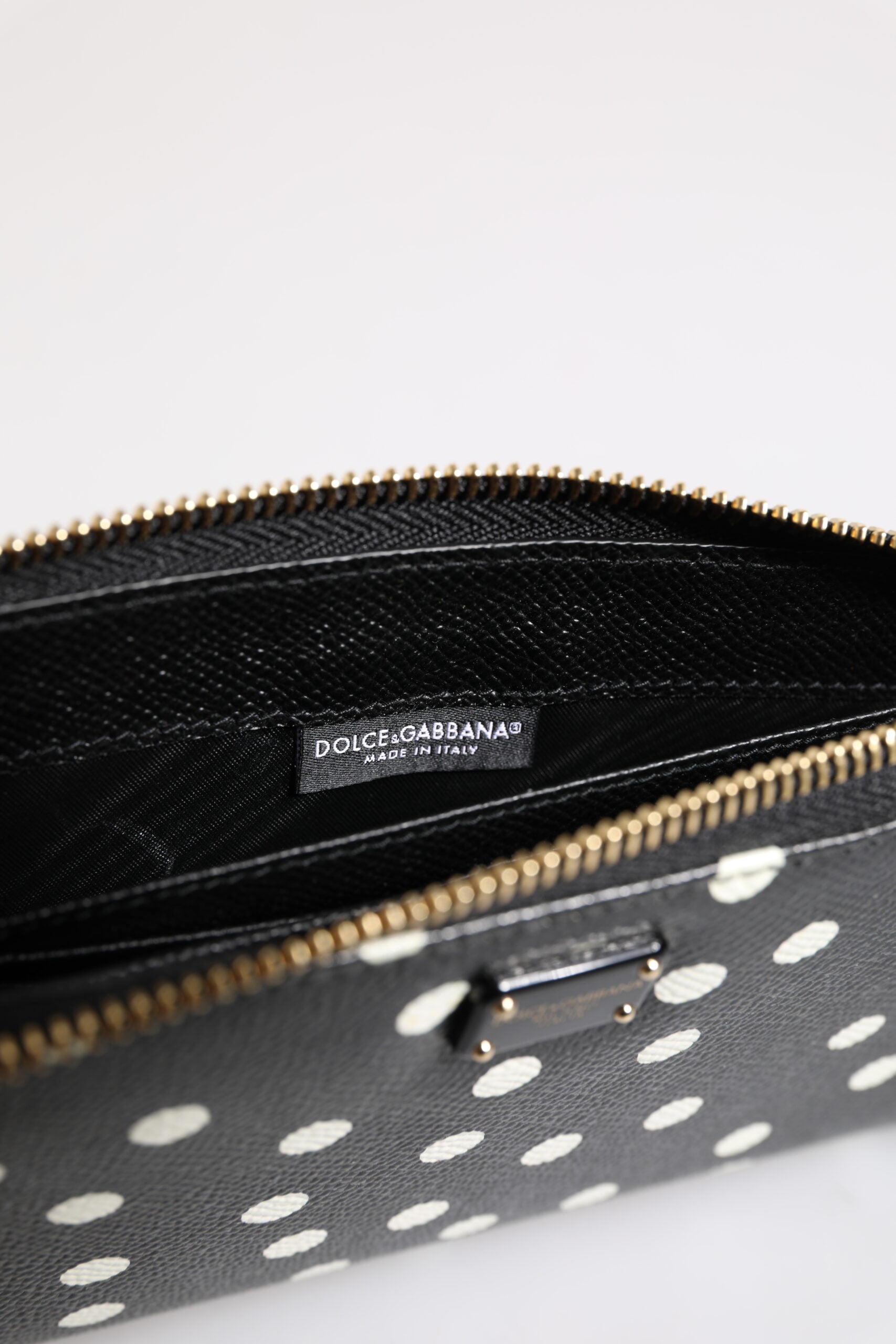 Portefeuille continental zippé Dolce & Gabbana en cuir noir et blanc à pois