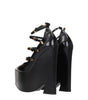 Broche en cuir noir Versace